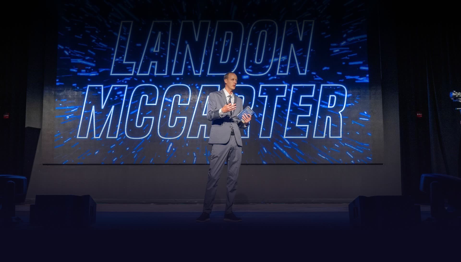 Landon McCarter speaking on stage